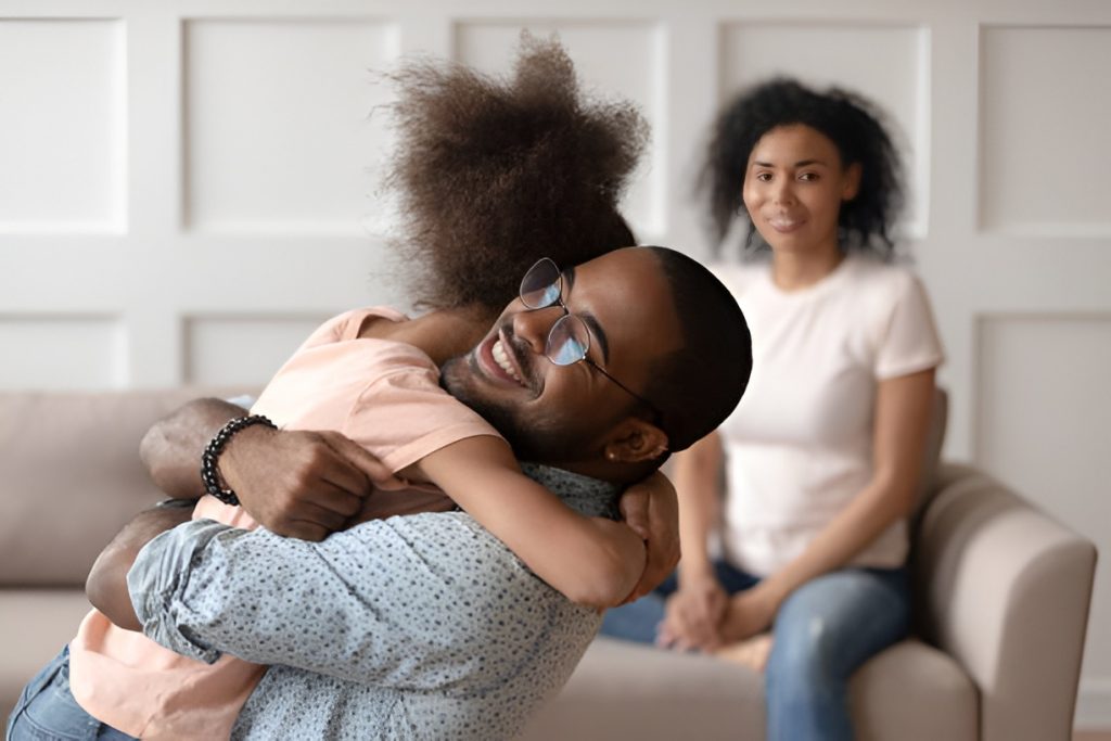 dad hugging his daughter