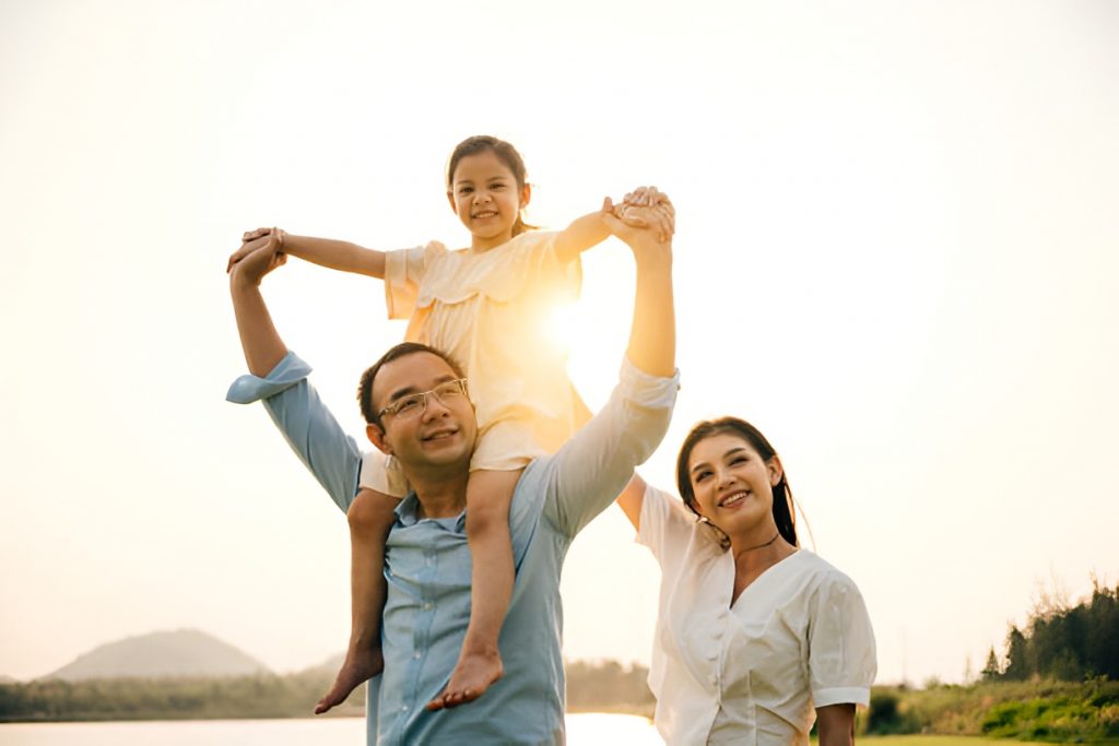 parents and daughter spending time outdoors